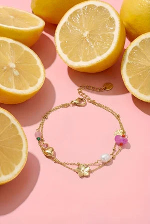 Bedelarmband met hart, bloem, parel en kraaltjes