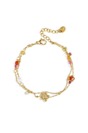 Bedelarmband met ster en bloemcharms, parels, steentjes